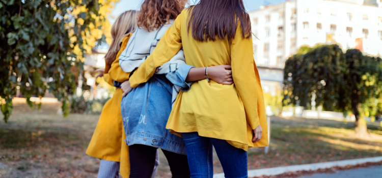 Three polyamorous girls walking together after a meeting with their socially conscious financial advisor